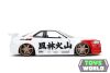 NISSAN - SKYLINE GT-R (R34) ADVAN 2002 WITH STREET FIGHTER RYU FIGURE - WHITE RED